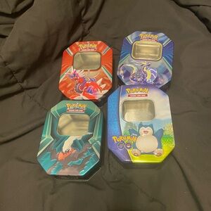 Pokémon Trading Card Game Tin Set - Red, Blue, Teal, Blue-Green